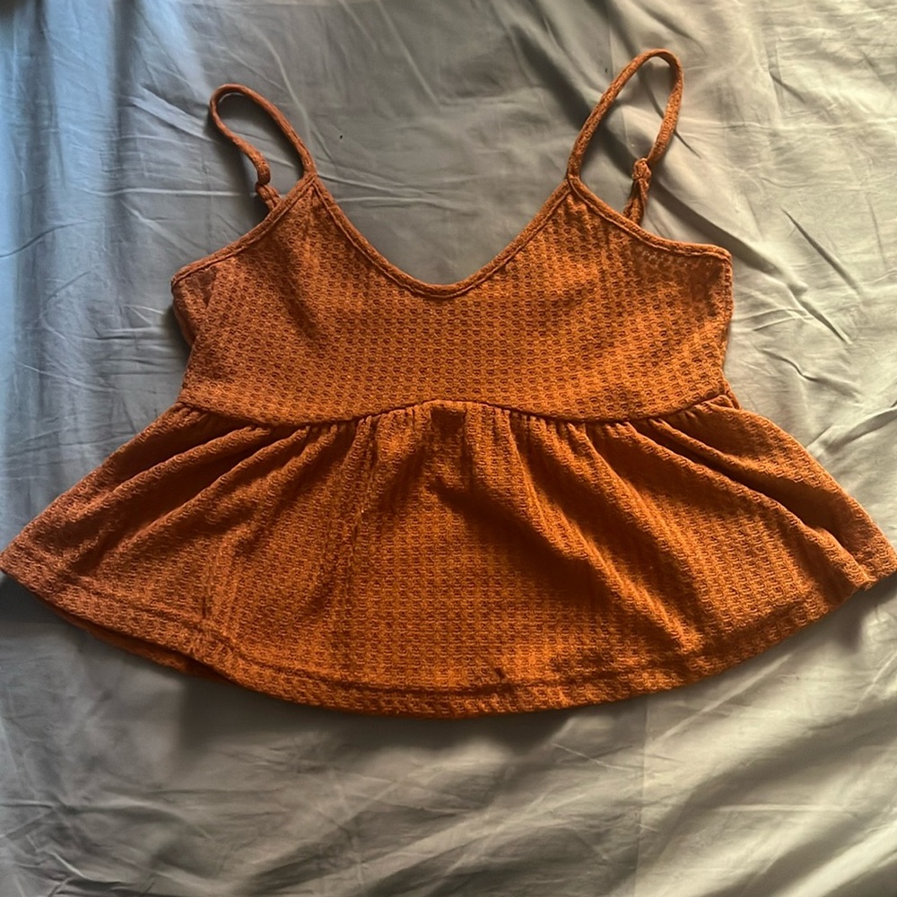 Selling a Shein cami-crop top, it’s size Medium. The color is a copper brown